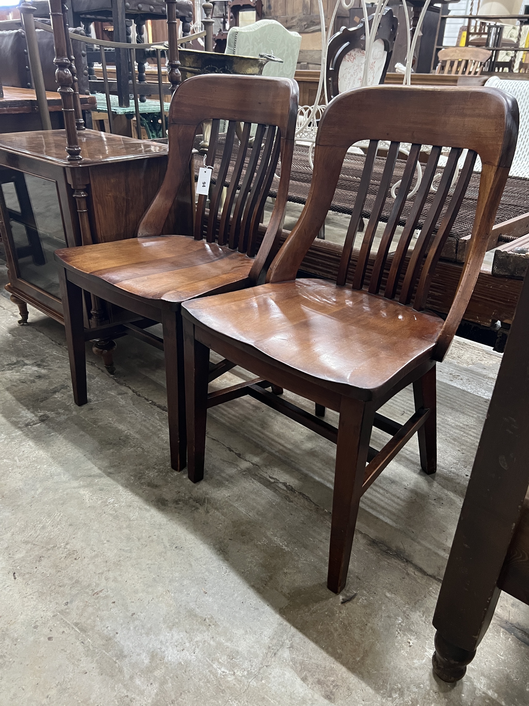 A pair of early 20th century mahogany office chairs, width 48cm, depth 43cm, height 86cm